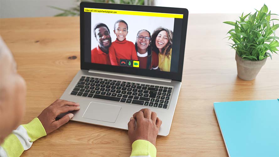 GuideConnect video call, family shown on a laptop screen